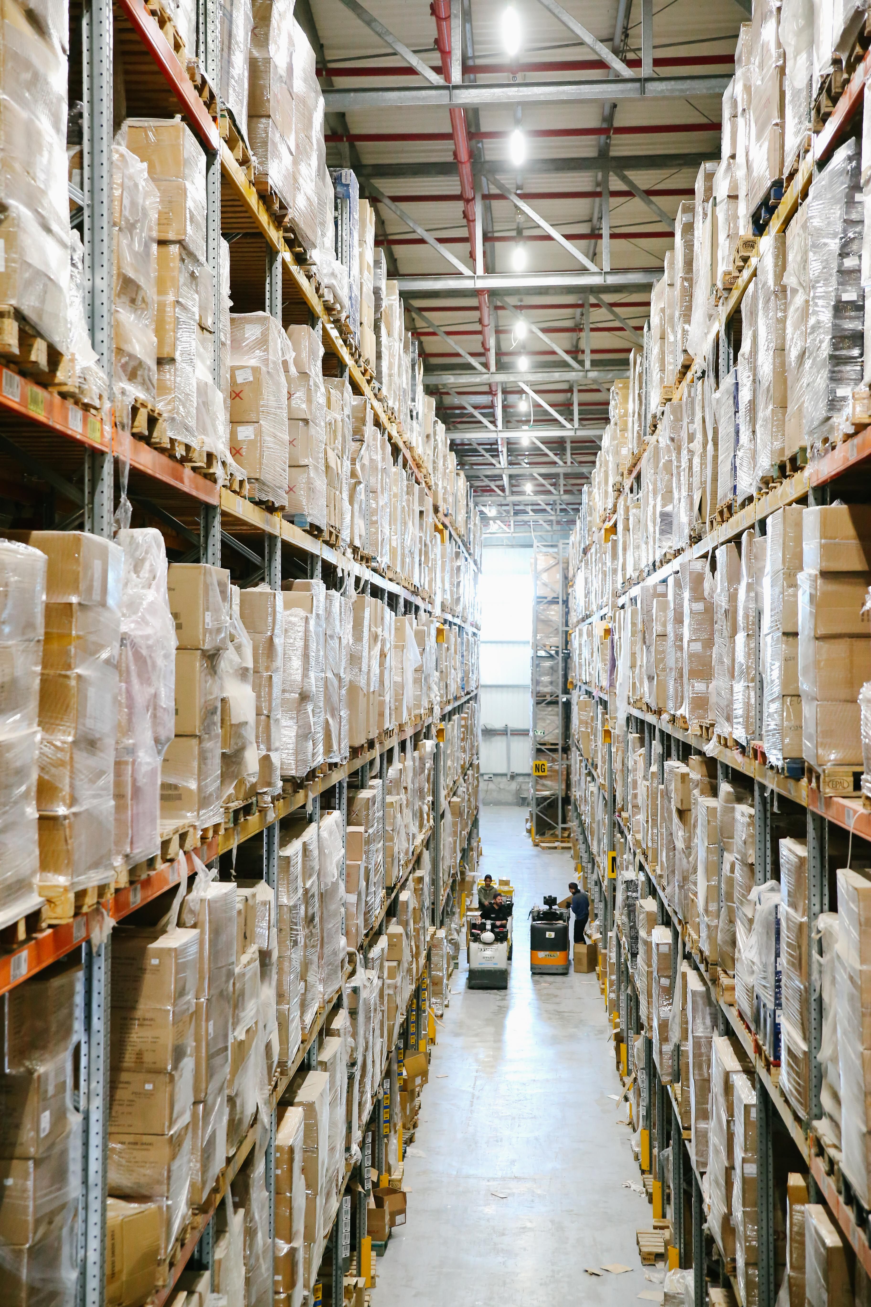 Warehouse shelves stocked with packages ready for storage